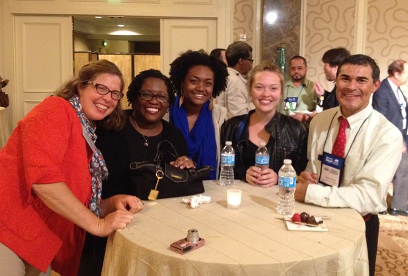 Graduate students and faculty at an event