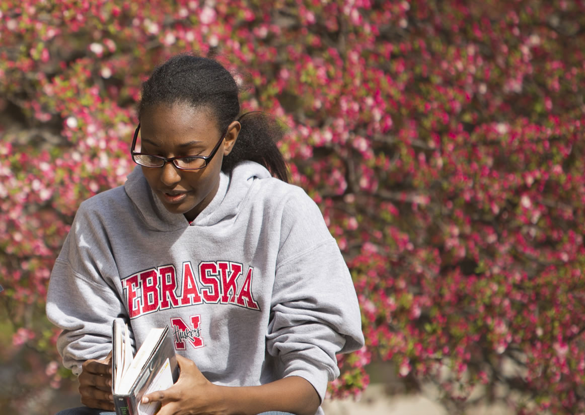 Student reading outside